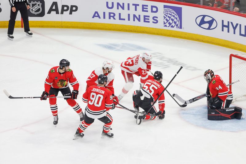 Feb 25, 2024; Chicago, Illinois, USA; Chicago Blackhawks goaltender Petr Mrazek (34) defends against the Detroit Red Wings during the first period at United Center. Mandatory Credit: Kamil Krzaczynski-USA TODAY Sports