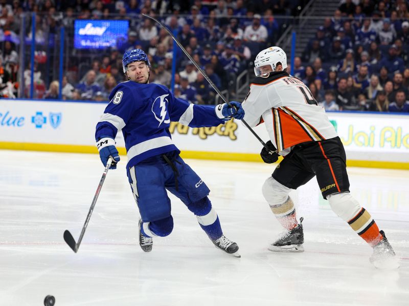 Jan 13, 2024; Tampa, Florida, USA;  Tampa Bay Lightning left wing Brandon Hagel (38) and Anaheim Ducks defenseman Cam Fowler (4) battle for the puck in the third period at Amalie Arena. Mandatory Credit: Nathan Ray Seebeck-USA TODAY Sports