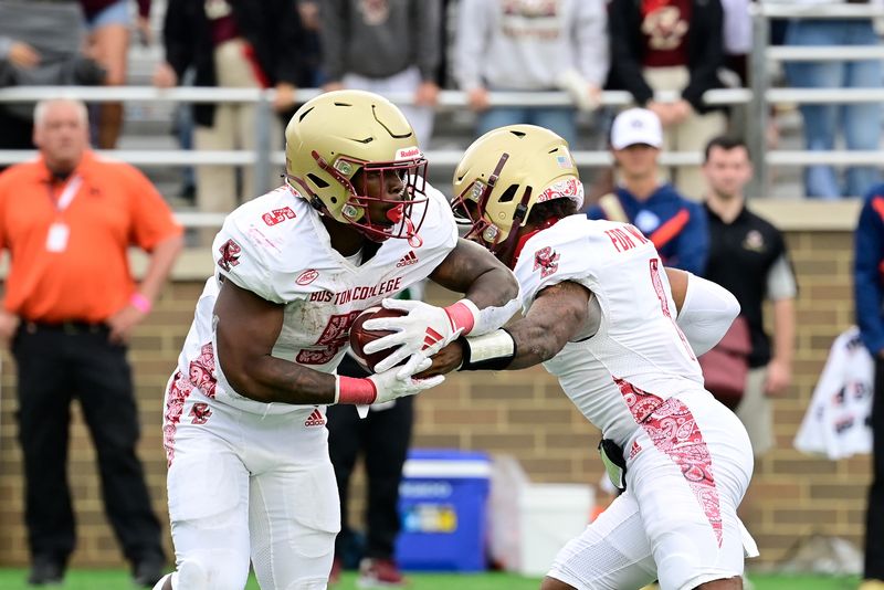 Sep 16, 2023; Chestnut Hill, Massachusetts, USA; Boston College Eagles quarterback Thomas Castellanos (1) hands the ball off to running back Kye Robichaux (5) during the second half against the Florida State Seminoles at Alumni Stadium. Mandatory Credit: Eric Canha-USA TODAY Sports