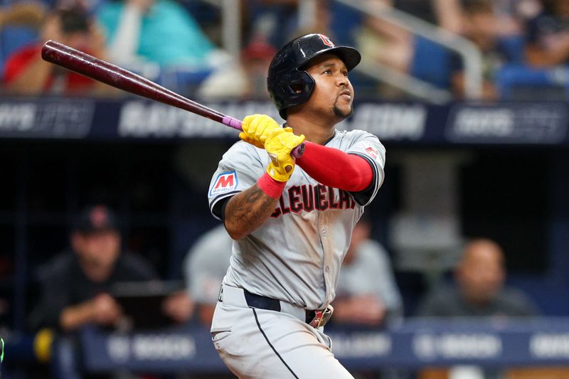 Jul 13, 2024; St. Petersburg, Florida, USA; Cleveland Guardians third baseman Jose Ramírez (11) doubles against the Tampa Bay Rays in the ninth inning at Tropicana Field. Mandatory Credit: Nathan Ray Seebeck-USA TODAY Sports