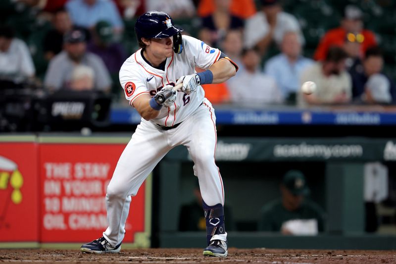 Sep 12, 2024; Houston, Texas, USA; Houston Astros center fielder Jake Meyers (6) bunts against the Oakland Athletics during the fourth inning at Minute Maid Park. Mandatory Credit: Erik Williams-Imagn Images