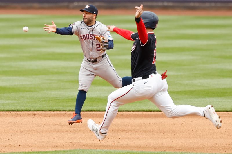 Apr 21, 2024; Washington, District of Columbia, USA; Houston Astros second base Jose Altuve (27) makes a play to second base ahead of a slide by Washington Nationals catcher Riley Adams (15) during the fifth inning at Nationals Park. Mandatory Credit: Geoff Burke-USA TODAY Sports