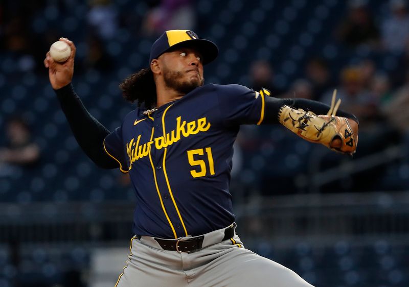 Sep 25, 2024; Pittsburgh, Pennsylvania, USA;  Milwaukee Brewers starting pitcher Freddy Peralta (51) delivers a pitch against the Pittsburgh Pirates during the first inning at PNC Park. Mandatory Credit: Charles LeClaire-Imagn Images