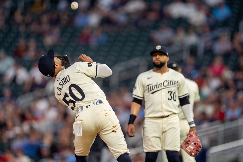 Sep 26, 2024; Minneapolis, Minnesota, USA; Minnesota Twins second base Willi Castro (50) catches the second out of the first inning hit by Miami Marlins second base Otto Lopez (61) at Target Field. Mandatory Credit: Matt Blewett-Imagn Images