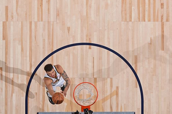 DENVER, CO - DECEMBER 25: Michael Porter Jr. #1 of the Denver Nuggets drives to the basket during the game against the Golden State Warriors on December 25, 2023 at the Ball Arena in Denver, Colorado. NOTE TO USER: User expressly acknowledges and agrees that, by downloading and/or using this Photograph, user is consenting to the terms and conditions of the Getty Images License Agreement. Mandatory Copyright Notice: Copyright 2023 NBAE (Photo by Bart Young/NBAE via Getty Images)