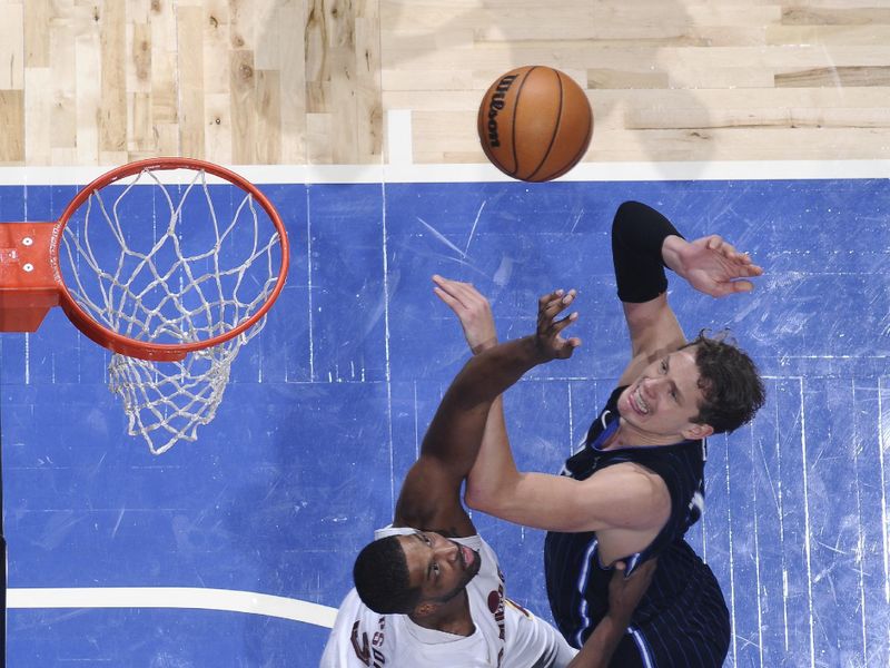 ORLANDO, FL - JANUARY 22: Moritz Wagner #21 of the Orlando Magic drives to the basket during the game against the Cleveland Cavaliers on January 22, 2024 at Kia Center in Orlando, Florida. NOTE TO USER: User expressly acknowledges and agrees that, by downloading and or using this photograph, User is consenting to the terms and conditions of the Getty Images License Agreement. Mandatory Copyright Notice: Copyright 2024 NBAE (Photo by Fernando Medina/NBAE via Getty Images)