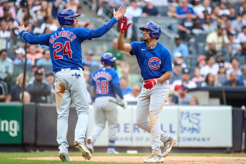 Jul 9, 2023; Bronx, New York, USA;  Chicago Cubs second baseman Christopher Morel (5) and center fielder Cody Bellinger (24) celebrate after tying the game in the seventh inning against the New York Yankees at Yankee Stadium. Mandatory Credit: Wendell Cruz-USA TODAY Sports