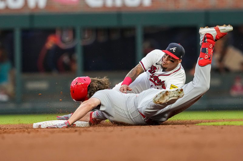 Sep 6, 2023; Cumberland, Georgia, USA; Atlanta Braves shortstop Orlando Arcia (11) tags out St. Louis Cardinals designated hitter Alec Burleson (41) at second base during the first inning at Truist Park. Mandatory Credit: Dale Zanine-USA TODAY Sports