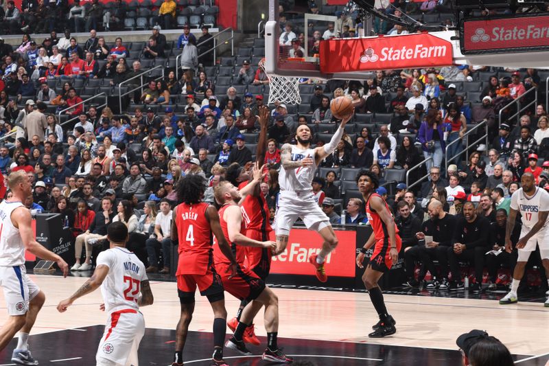 LOS ANGELES, CA - APIRL 14: Amir Coffey #7 of the LA Clippers drives to the basket during the game against the Houston Rockets on April 14, 2024 at Crypto.Com Arena in Los Angeles, California. NOTE TO USER: User expressly acknowledges and agrees that, by downloading and/or using this Photograph, user is consenting to the terms and conditions of the Getty Images License Agreement. Mandatory Copyright Notice: Copyright 2024 NBAE (Photo by Adam Pantozzi/NBAE via Getty Images)