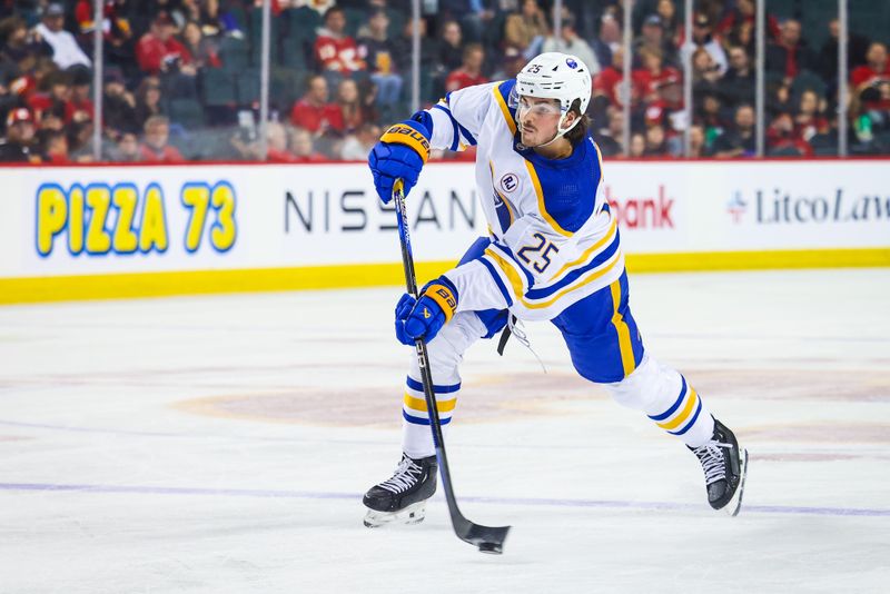 Mar 24, 2024; Calgary, Alberta, CAN; Buffalo Sabres defenseman Owen Power (25) shoots the puck against the Calgary Flames during the first period at Scotiabank Saddledome. Mandatory Credit: Sergei Belski-USA TODAY Sports