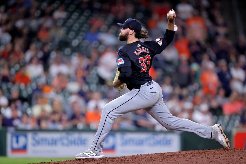 Apr 30, 2024; Houston, Texas, USA; Cleveland Guardians pitcher Hunter Gaddis (33) delivers a pitch against the Houston Astros during the tenth inning at Minute Maid Park. Mandatory Credit: Erik Williams-USA TODAY Sports