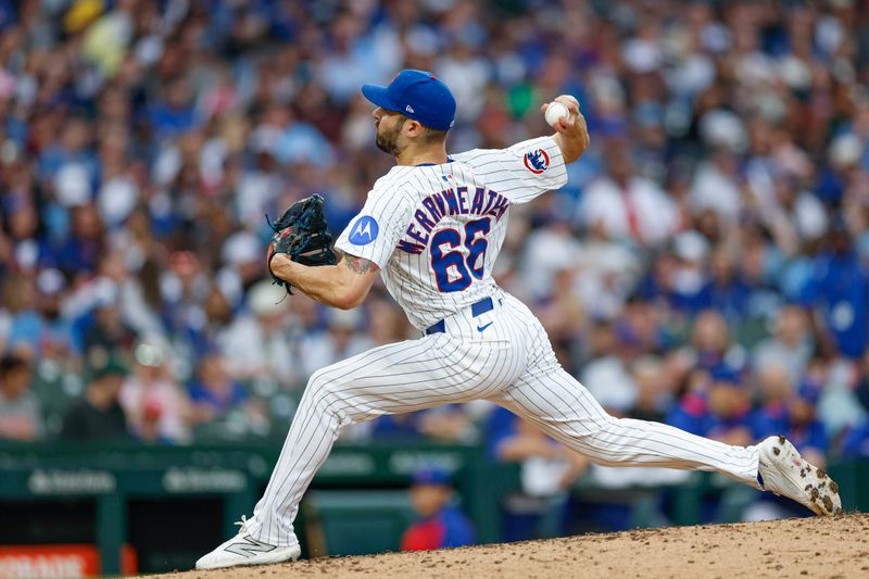 Apr 18, 2025; Chicago, Illinois, USA; Chicago Cubs relief pitcher Julian Merryweather (66) delivers a pitch against the Arizona Diamondbacks during the seventh inning at Wrigley Field. Mandatory Credit: Kamil Krzaczynski-Imagn Images