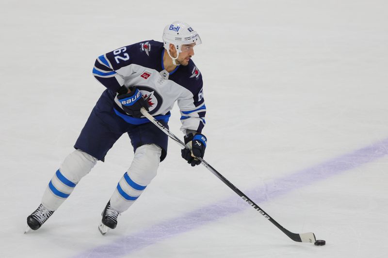 Nov 24, 2023; Sunrise, Florida, USA; Winnipeg Jets right wing Nino Niederreiter (62) moves the puck against the Florida Panthers during the third period at Amerant Bank Arena. Mandatory Credit: Sam Navarro-USA TODAY Sports