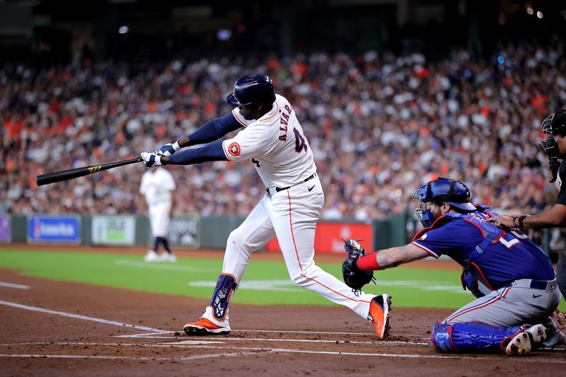 Jul 13, 2024; Houston, Texas, USA; Houston Astros designated hitter Yordan Alvarez (44) hits a single against the Texas Rangers during the first inning at Minute Maid Park. Mandatory Credit: Erik Williams-USA TODAY Sports