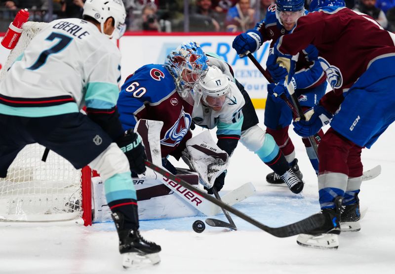 Nov 5, 2024; Denver, Colorado, USA; Seattle Kraken center Jaden Schwartz (17) attempts to score on Colorado Avalanche goaltender Justus Annunen (60) in the third period at Ball Arena. Mandatory Credit: Ron Chenoy-Imagn Images