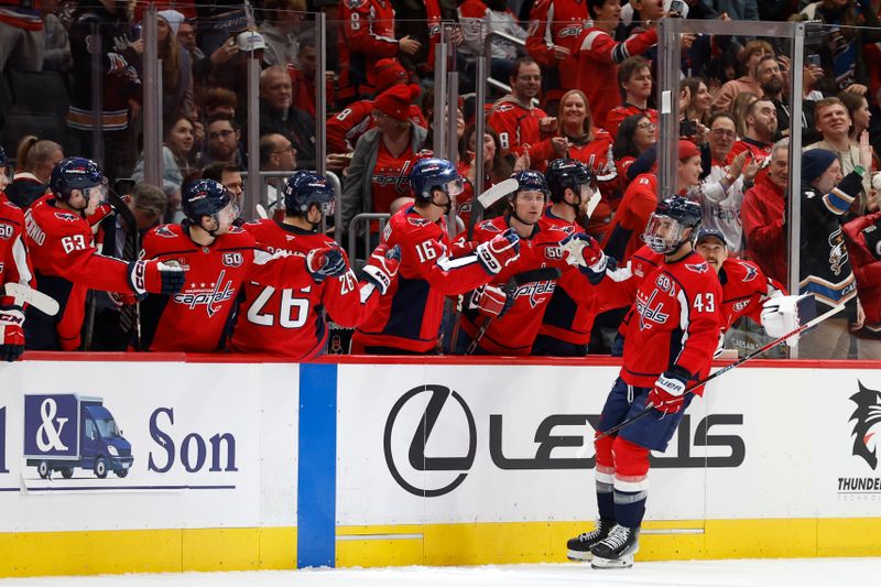 Dec 14, 2024; Washington, District of Columbia, USA; Washington Capitals right wing Tom Wilson (43) celebrates with teammates after scoring a goal against the Buffalo Sabres in the second period at Capital One Arena. Mandatory Credit: Geoff Burke-Imagn Images