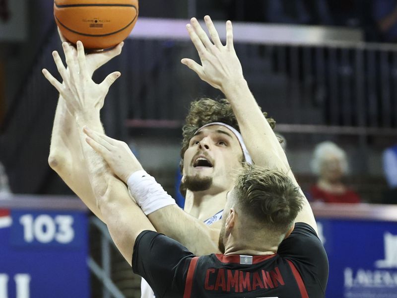 Feb 1, 2025; Dallas, Texas, USA;  Southern Methodist Mustangs forward Matt Cross (33) shoots over Stanford Cardinal forward Aidan Cammann (52) during the first half at Moody Coliseum. Mandatory Credit: Kevin Jairaj-Imagn Images