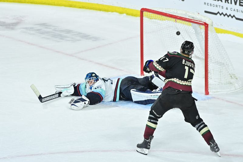 Nov 7, 2023; Tempe, Arizona, USA; Arizona Coyotes center Nick Bjugstad (17) scores on Seattle Kraken goaltender Joey Daccord (35) in the shootout  at Mullett Arena. Mandatory Credit: Matt Kartozian-USA TODAY Sports