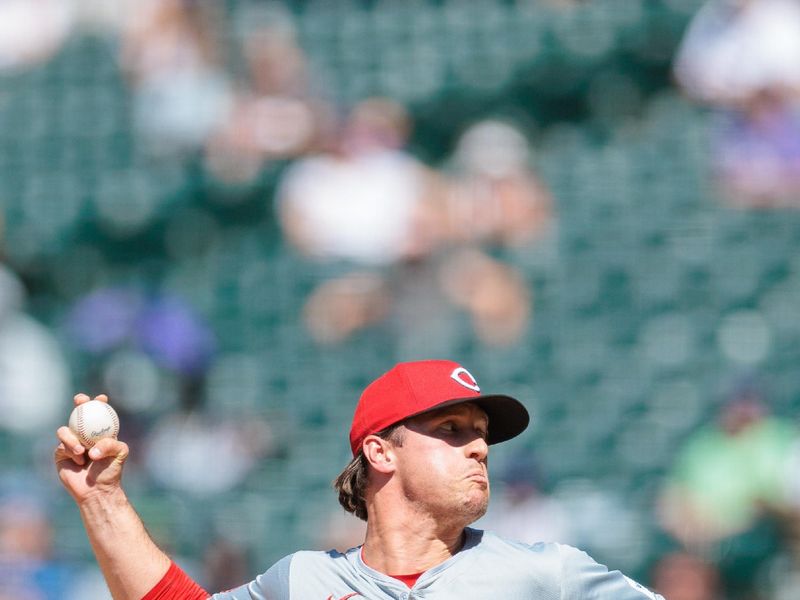 Jun 5, 2024; Denver, Colorado, USA; Cincinnati Reds relief pitcher Lucas Sims (39) delivers a pitch during the seventh inning against the Colorado Rockies at Coors Field. Mandatory Credit: Andrew Wevers-USA TODAY Sports