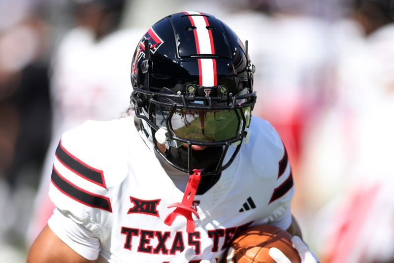 Oct 26, 2024; Fort Worth, Texas, USA;  Texas Tech Red Raiders defensive back Bralyn Lux (0) warms up before a game against the TCU Horned Frogs at Amon G. Carter Stadium. Mandatory Credit: Tim Heitman-Imagn Images