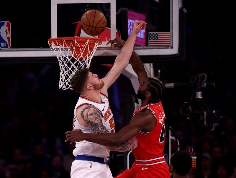 NEW YORK, NEW YORK - JANUARY 03: Isaiah Hartenstein #55 of the New York Knicks blocks a shot by Patrick Williams #44 of the Chicago Bulls during the first half at Madison Square Garden on January 03, 2024 in New York City. NOTE TO USER: User expressly acknowledges and agrees that, by downloading and or using this photograph, User is consenting to the terms and conditions of the Getty Images License Agreement. (Photo by Elsa/Getty Images)