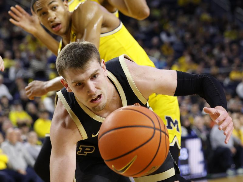 Feb 25, 2024; Ann Arbor, Michigan, USA;  Purdue Boilermakers guard Braden Smith (3) goes after a loose ball in the first half against the Michigan Wolverines at Crisler Center. Mandatory Credit: Rick Osentoski-USA TODAY Sports