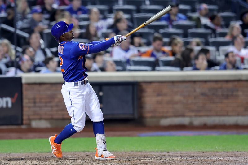 Sep 30, 2023; New York City, New York, USA; New York Mets shortstop Francisco Lindor (12) follows through on a two run home run against the Philadelphia Phillies during the fourth inning at Citi Field. Mandatory Credit: Brad Penner-USA TODAY Sports