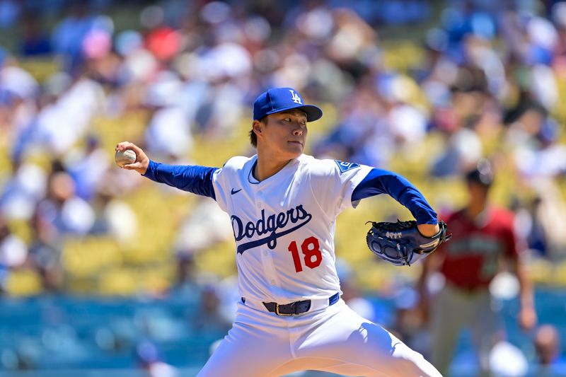 Aug 31, 2025; Los Angeles, California, USA; Los Angeles Dodgers starting pitcher Yoshinobu Yamamoto (18) pitches during the first inning at Dodger Stadium. Mandatory Credit: Jayne Kamin-Oncea-Imagn Images