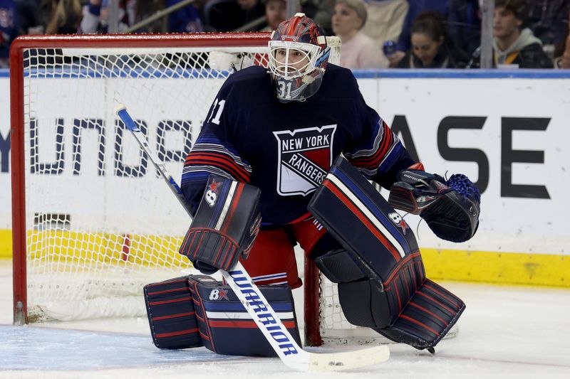 Dec 6, 2024; New York, New York, USA; New York Rangers goaltender Igor Shesterkin (31) tends net against the Pittsburgh Penguins during the second period at Madison Square Garden. Mandatory Credit: Brad Penner-Imagn Images