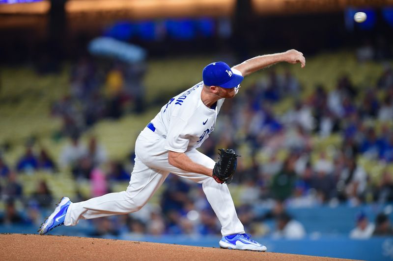 Sep 19, 2023; Los Angeles, California, USA; Los Angeles Dodgers relief pitcher Caleb Ferguson (64) throws against the Detroit Tigers during the first inning at Dodger Stadium. Mandatory Credit: Gary A. Vasquez-USA TODAY Sports