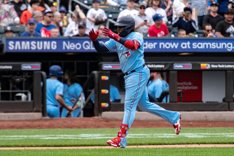 Jun 4, 2023; New York City, New York, USA; Toronto Blue Jays first baseman Vladimir Guerrero Jr. (27) rounds the bases after hitting a home run against the New York Mets during the third inning at Citi Field. Mandatory Credit: John Jones-USA TODAY Sports