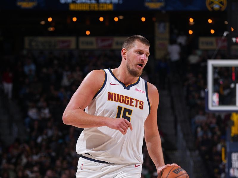 DENVER, CO - OCTOBER 13: Nikola Jokic #15 of the Denver Nuggets dribbles the ball during the game against the Phoenix Suns on October 13, 2024 at Ball Arena in Denver, Colorado. NOTE TO USER: User expressly acknowledges and agrees that, by downloading and/or using this Photograph, user is consenting to the terms and conditions of the Getty Images License Agreement. Mandatory Copyright Notice: Copyright 2024 NBAE (Photo by Bart Young/NBAE via Getty Images)