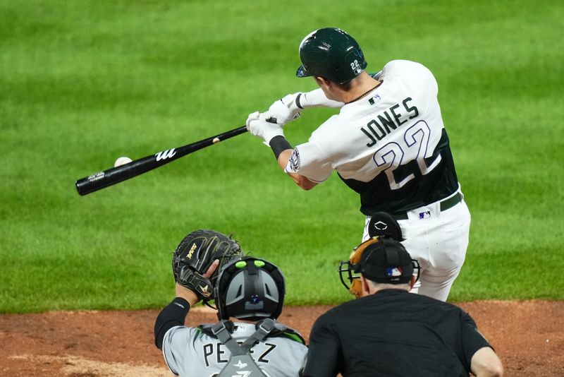 Aug 19, 2023; Denver, Colorado, USA; Colorado Rockies right fielder Nolan Jones (22) singles in the eighth inning against the Chicago White Sox at Coors Field. Mandatory Credit: Ron Chenoy-USA TODAY Sports