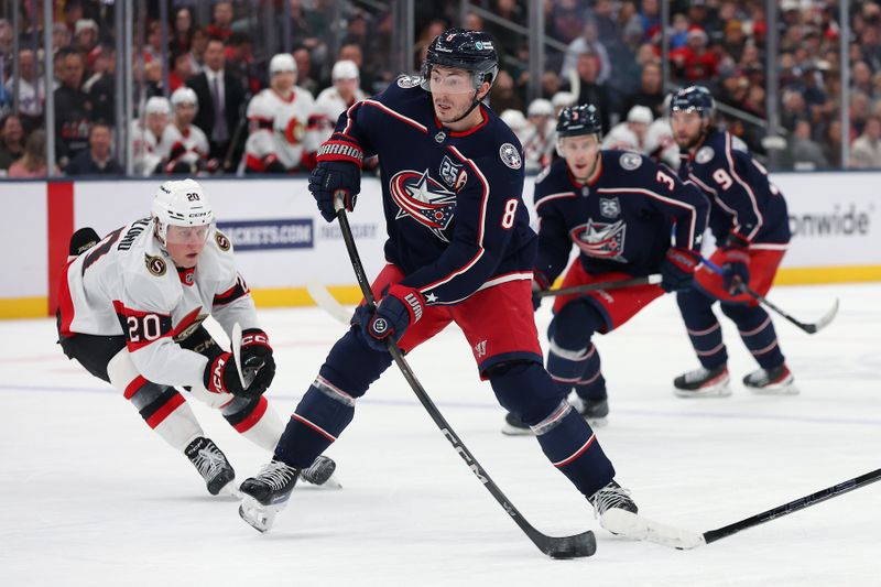 Dec 11, 2025; Columbus, Ohio, USA;  Columbus Blue Jackets center Kent Johnson (91) shoots the puck as Ottawa Senators left wing Fabian Zetterlund (20) defends during the second period at Nationwide Arena. Mandatory Credit: Joseph Maiorana-Imagn Images