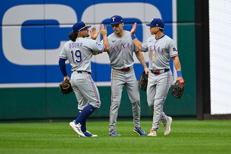 Jun 8, 2025; Washington, District of Columbia, USA; Texas Rangers right fielder Sam Haggerty (0) and center fielder Evan Carter (32) and left fielder Alejandro Osuna (19) celebrate after the game against the Washington Nationals at Nationals Park. Mandatory Credit: Brad Mills-Imagn Images