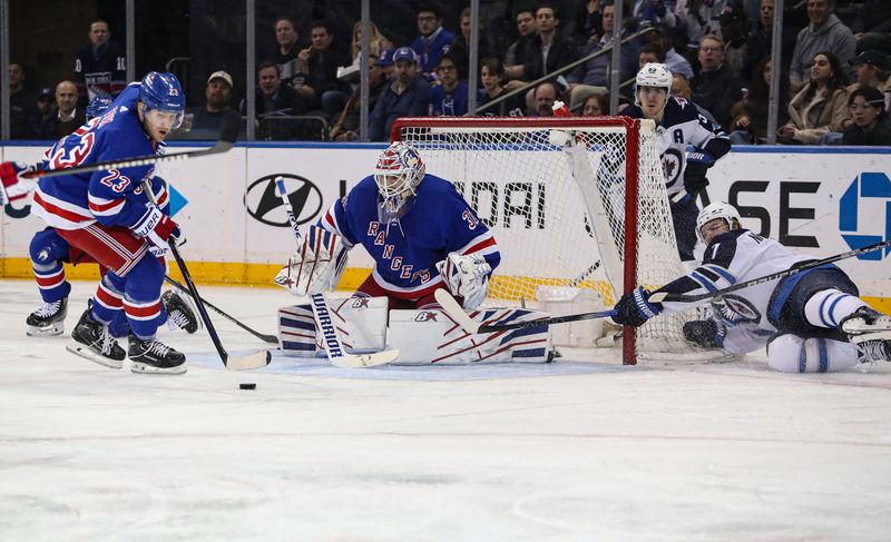 Mar 19, 2024; New York, New York, USA; New York Rangers goalie Igor Shesterkin (31) makes a save on a shot by Winnipeg Jets center Vladislav Namestnikov (7) during the second period at Madison Square Garden. Mandatory Credit: Danny Wild-USA TODAY Sports