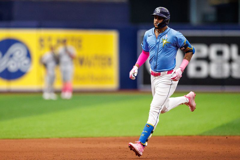 May 12, 2024; St. Petersburg, Florida, USA;  Tampa Bay Rays outfielder Jose Siri (22) runs the bases after hitting a grand slam against the New York Yankees in the seventh inning at Tropicana Field. Mandatory Credit: Nathan Ray Seebeck-USA TODAY Sports