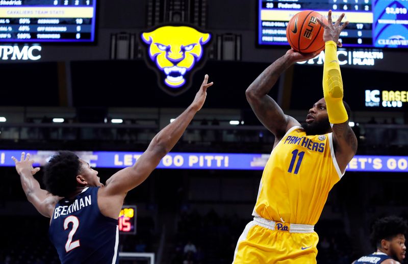 Jan 3, 2023; Pittsburgh, Pennsylvania, USA;  Pittsburgh Panthers guard Jamarius Burton (11) shoots against Virginia Cavaliers guard Reece Beekman (2) during the second half at the Petersen Events Center. Pittsburgh won 68-65. Mandatory Credit: Charles LeClaire-USA TODAY Sports