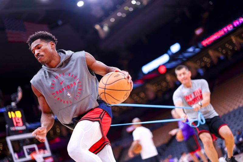 TORONTO, CANADA - OCTOBER 28: Ochai Agbaji #30 of the Toronto Raptors warms up before the game against the Denver Nuggets on October 28, 2024 at the Scotiabank Arena in Toronto, Ontario, Canada.  NOTE TO USER: User expressly acknowledges and agrees that, by downloading and or using this Photograph, user is consenting to the terms and conditions of the Getty Images License Agreement.  Mandatory Copyright Notice: Copyright 2024 NBAE (Photo by Vaughn Ridley/NBAE via Getty Images)