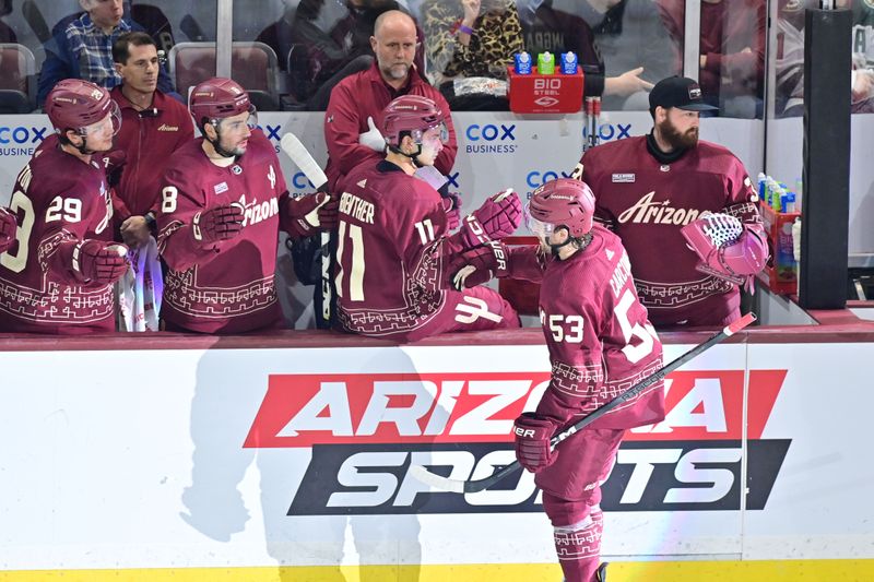 Mar 7, 2024; Tempe, Arizona, USA; Arizona Coyotes left wing Michael Carcone (53) celebrates with teammates after scoring a goal in the third period against the Minnesota Wild at Mullett Arena. Mandatory Credit: Matt Kartozian-USA TODAY Sports