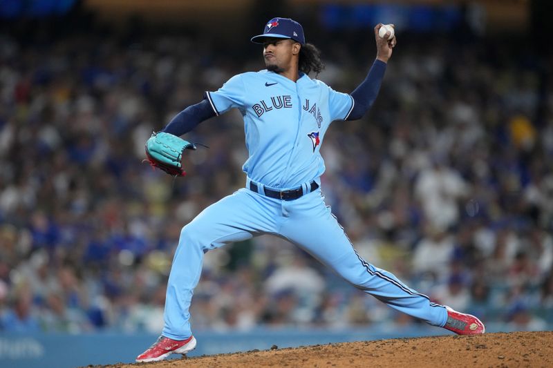 Jul 25, 2023; Los Angeles, California, USA; Toronto Blue Jays relief pitcher Genesis Cabrera (92) throws in the seventh nning against the Los Angeles Dodgers at Dodger Stadium. Mandatory Credit: Kirby Lee-USA TODAY Sports