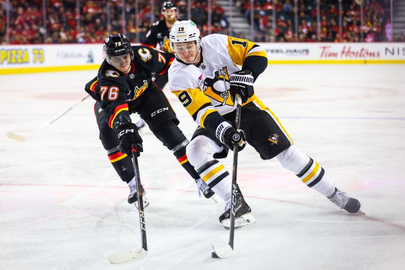 Oct 22, 2024; Calgary, Alberta, CAN; Pittsburgh Penguins center Cody Glass (19) controls the puck against Calgary Flames center Martin Pospisil (76) during the first period at Scotiabank Saddledome. Mandatory Credit: Sergei Belski-Imagn Images
