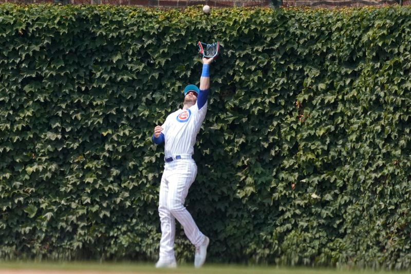 Jun 18, 2023; Chicago, Illinois, USA; Chicago Cubs left fielder Ian Happ (8) makes a catch on Baltimore Orioles third baseman Ramon Urias (not pictured) during the eighth inning at Wrigley Field. Mandatory Credit: David Banks-USA TODAY Sports