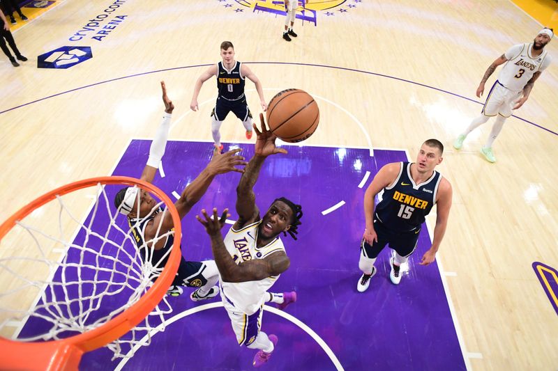 LOS ANGELES, CA - APRIL 27: Taurean Prince #12 of the Los Angeles Lakers drives to the basket during the game against the Denver Nuggets during Round 1 Game 4 of the 2024 NBA Playoffs on April 27, 2024 at Crypto.Com Arena in Los Angeles, California. NOTE TO USER: User expressly acknowledges and agrees that, by downloading and/or using this Photograph, user is consenting to the terms and conditions of the Getty Images License Agreement. Mandatory Copyright Notice: Copyright 2024 NBAE (Photo by Adam Pantozzi/NBAE via Getty Images)