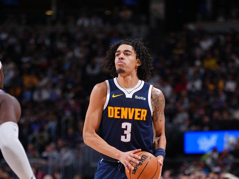 DENVER, CO - NOVEMBER 6: Julian Strawther #3 of the Denver Nuggets handles the ball during the game against the Oklahoma City Thunder on November 6, 2024 at Ball Arena in Denver, Colorado. NOTE TO USER: User expressly acknowledges and agrees that, by downloading and/or using this Photograph, user is consenting to the terms and conditions of the Getty Images License Agreement. Mandatory Copyright Notice: Copyright 2024 NBAE (Photo by Garrett Ellwood/NBAE via Getty Images)