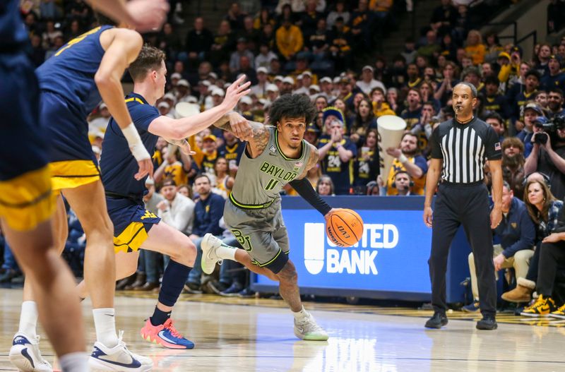 Feb 17, 2024; Morgantown, West Virginia, USA; Baylor Bears forward Jalen Bridges (11) dribbles against West Virginia Mountaineers forward Quinn Slazinski (11) during the first half at WVU Coliseum. Mandatory Credit: Ben Queen-USA TODAY Sports