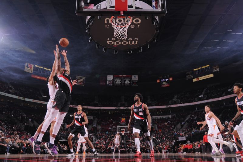 PORTLAND, OR - JANUARY 14: Jabari Walker #34 of the Portland Trail Blazers rebounds the ball during the game against the Phoenix Suns on January 14, 2024 at the Moda Center Arena in Portland, Oregon. NOTE TO USER: User expressly acknowledges and agrees that, by downloading and or using this photograph, user is consenting to the terms and conditions of the Getty Images License Agreement. Mandatory Copyright Notice: Copyright 2024 NBAE (Photo by Cameron Browne/NBAE via Getty Images)