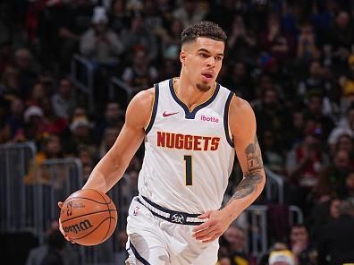 DENVER, CO - DECEMBER 25: Michael Porter Jr. #1 of the Denver Nuggets brings the ball up court against the Golden State Warriors on December 25, 2023 at the Ball Arena in Denver, Colorado. NOTE TO USER: User expressly acknowledges and agrees that, by downloading and/or using this Photograph, user is consenting to the terms and conditions of the Getty Images License Agreement. Mandatory Copyright Notice: Copyright 2023 NBAE (Photo by Bart Young/NBAE via Getty Images)