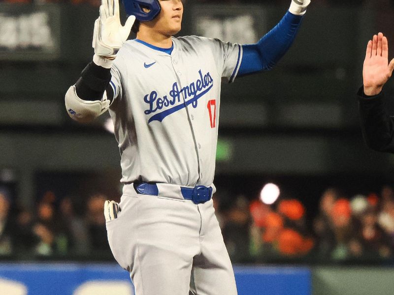 May 14, 2024; San Francisco, California, USA; Los Angeles Dodgers designated hitter Shohei Ohtani (17) gestures after hitting a RBI double against the San Francisco Giants during the seventh inning at Oracle Park. Mandatory Credit: Kelley L Cox-USA TODAY Sports