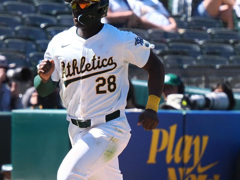 May 23, 2024; Oakland, California, USA; Oakland Athletics left fielder Daz Cameron (28) scores a run against the Colorado Rockies during the eleventh inning at Oakland-Alameda County Coliseum. Mandatory Credit: Kelley L Cox-USA TODAY Sports